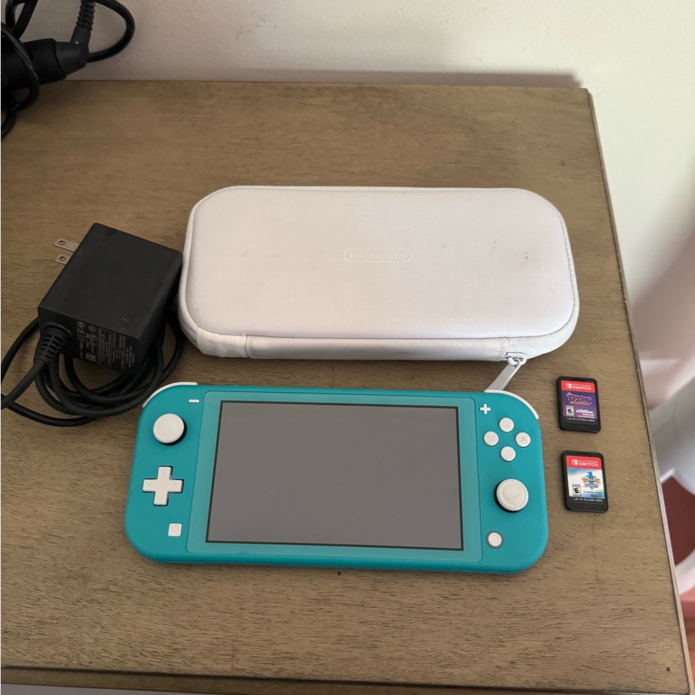 Nintendo Switch Lite with Pokémon sword and Spiro game bundle